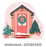 The front door is decorated for Christmas.House entrance decorated with Xmas wreath, lanterns on porch, festive ornaments and snow on winter holiday.