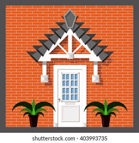 front doors to the house with a shed on a red brick wall