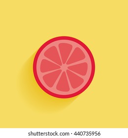 front slice of grapefruit in yellow color backdrop