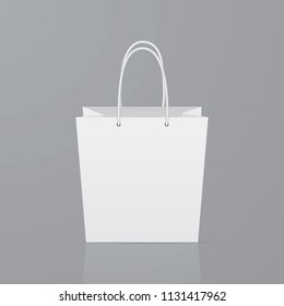 Front view of empty paper shopping bag on gray background. Realistic mockup template. Eco friendly package. Ease to edit vector illustration for advertising shops and markets. 