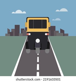 Front view of an Indian three wheeler 'Auto rickshaw' moving through the city