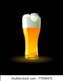 Frosty glass of light beer on black background