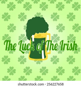 frothy green beer on background patterns clover