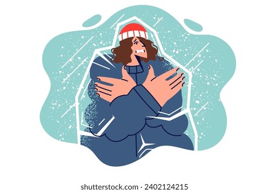 Frozen woman inside icy iceberg, shivering due to lack of warm clothing, stands among falling snow. Frozen girl needs warm shelter and risks get sick with flu or getting frostbite on hands and feet