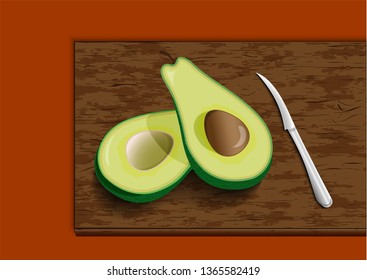 Fruit avocado with knife on cutting board