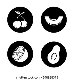 Fruit icons set. Cherries, melon slice, lemon half, open avocado. Vector white silhouettes illustrations in black circles