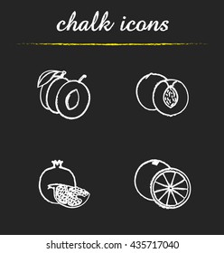 Fruit icons set. Halved plum, cutted peach and orange, pomegranate piece illustrations. Isolated vector chalkboard drawings