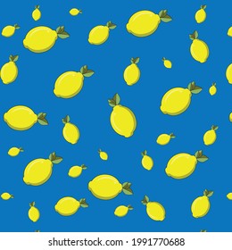 Fruit pattern from fresh yellow lemons on a blue background. creative summer concept.