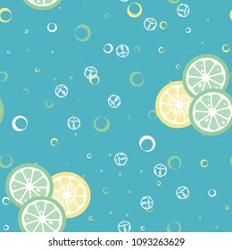 Fruit pattern with lemon and lime, ice cubes and mint leaves on a blue background. Stylish background with citrus for fabric, cover, plastic. Cold cocktail with lemon and lime. Freshness.