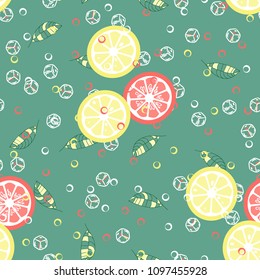 Fruit pattern with lemon and lime, ice cubes and mint leaves on a blue background. Stylish background with citrus for fabric, cover, plastic. Cold cocktail with lemon and lime. Freshness