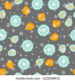 Fruit pattern with lemon and lime, ice cubes and mint leaves on a blue background. Stylish background with citrus for fabric, cover, plastic. Cold cocktail with lemon and lime. Freshness