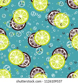 Fruit pattern with lemon and lime, ice cubes and mint leaves on a blue background. Cold cocktail with lemon. Freshness.