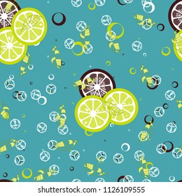 Fruit pattern with lemon and lime, ice cubes and mint leaves on a blue background. Cold cocktail with lemon. Freshness.