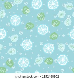 Fruit pattern with lemon and lime, ice cubes and mint leaves on a blue background. Cold cocktail with lemon. Freshness.