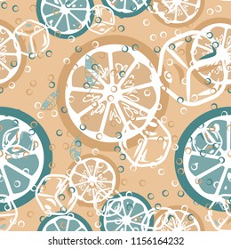 Fruit pattern with lemon and lime, ice cubes and mint leaves on a blue background. Cold cocktail with lemon. Freshness.