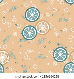 Fruit pattern with lemon and lime, ice cubes and mint leaves on a blue background. Cold cocktail with lemon. Freshness.