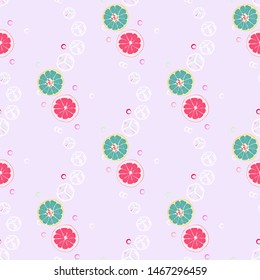 Fruit pattern with lemon and lime, ice cubes and mint leaves on a blue background. Cold cocktail with lemon. Freshness.
