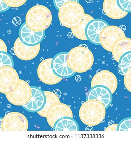 Fruit pattern with lemon and orange, ice cubes and mint leaves. Cold cocktail with lemon. Freshness.