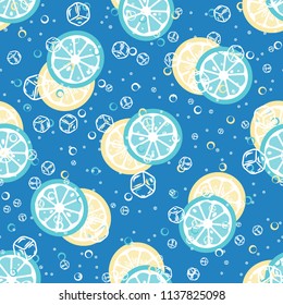 Fruit pattern with lemon and orange, ice cubes and mint leaves. Cold cocktail with lemon. Freshness.