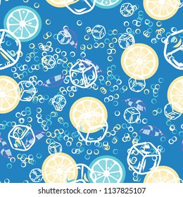 Fruit pattern with lemon and orange, ice cubes and mint leaves. Cold cocktail with lemon. Freshness.