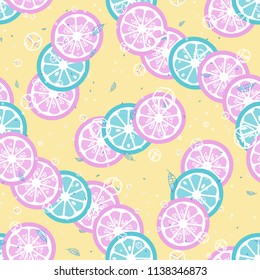 Fruit pattern with lemon and orange, ice cubes and mint leaves. Cold cocktail with lemon. Freshness.