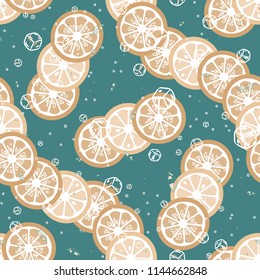 Fruit pattern with lemon and orange, ice cubes and mint leaves on a blue background. Cold cocktail with lemon. Freshness.