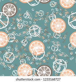 Fruit pattern with lemon and orange, ice cubes and mint leaves. Cold cocktail with lemon. Freshness.