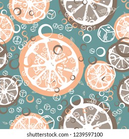 Fruit pattern with lemon and orange, ice cubes and mint leaves. Cold cocktail with lemon. Freshness.