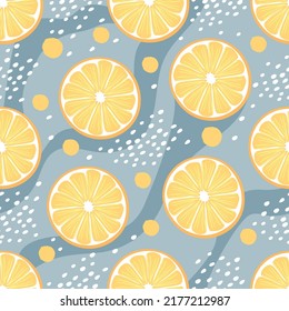 Fruit seamless pattern with lemon round slices.Yellow citrus slices with wavy stripes, dots and circles on pastel  blue.Background and texture for printing on fabric and paper.Vector illustration. 