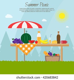 Fruit, wine, barbecue, grill, watermelon on the grass. Summer picnic on meadow under umbrella.