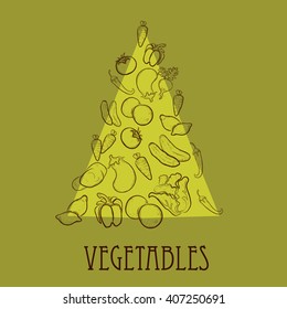 Fruits and vegetables in the shape of a triangle on a green background. 