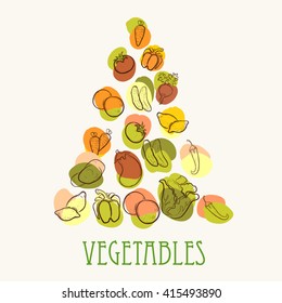 Fruits and vegetables in the shape of a triangle on a white background. 