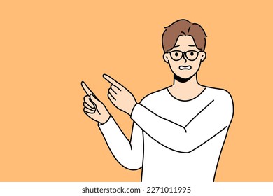 Frustrated man point with finger at empty advertising space. Confused unhappy guy recommend deal or offer feel awkward. Vector illustration. 