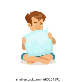 Frustrated sad boy character sitting on the floor and crying with a pillow vector Illustration