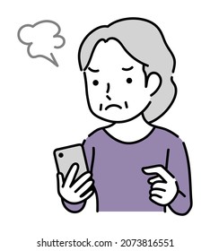 Frustrated senior woman operating a smartphone
