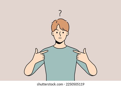 Frustrated young man feel confused point at himself. Unhappy guy feeling anxious showing with finger at him. Confusion and frustration. 