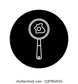frying eggs icon with black background