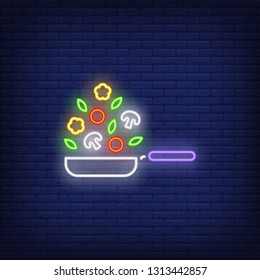 Frying pan and vegetable ingredients neon sign. Cooking, kitchen and restaurant advertisement design. Night bright neon sign, colorful billboard, light banner. Vector illustration in neon style.
