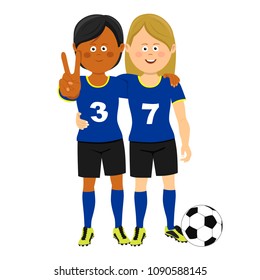 Full length portrait of two female soccer players hugging showing victory sign posing with ball