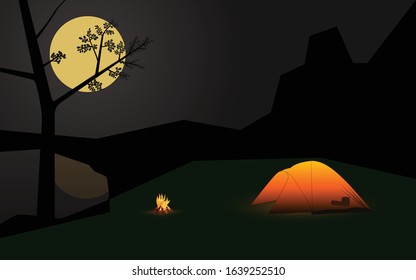 Full moon night landscape and reflection on the fresh water in the lake. orange Tent illuminated and campfire at camping park
