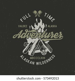 Full time adventurer vintage label with textured bonfire, axe and type elements. Alaska wilderness retro emblem. Vector letterpress effect..