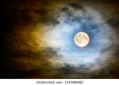 Full vector moon over dark cloudy midnight sky. Spooky moonlight Halloween background