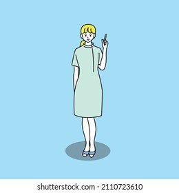 A full-body figure of a woman in a white coat with a smile that explains by pointing her finger