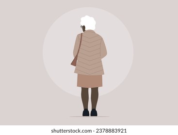 A full-length portrait of an older African lady, viewed from behind, wearing a casual classic outfit