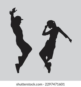 Full-length shot of two young dancers dancing street-dance style isolated on the silhouette