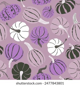 Fun bright pumpkin seamless pattern in purple, pink, lilac colors. Halloween modern repeat pattern for textile and paper design.