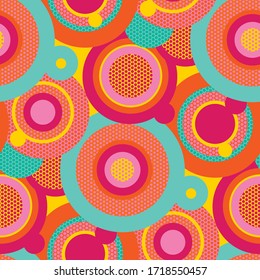 Fun colorful pop art circles seamless pattern for background, fabric, textile, wrap, surface, web and print design. Vintage vibes pink and yellow color repeatable motif. 
