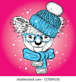 Fun koala in hat and scarf. Vector illustration for postcard or poster, print on clothes. New Year and Christmas, winter. Very cute cub.