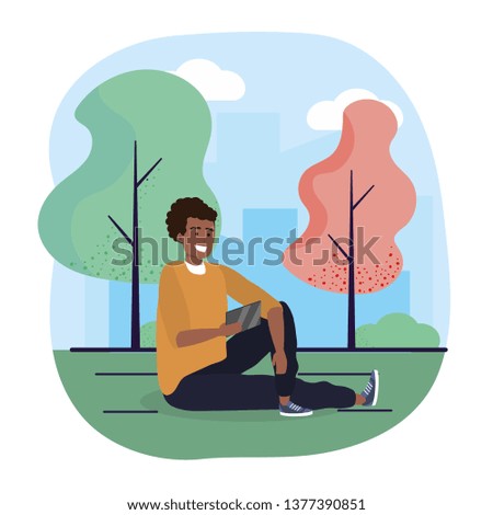 fun man seating with smartphone and trees