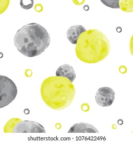 Fun and modern seamless pattern painted with watercolors. Yellow and blue circular spots distributed randomly on a transparent background. This pattern is part of the yellow collection.